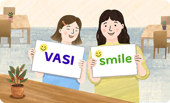 스마일 패널을 들고 있는 두여성